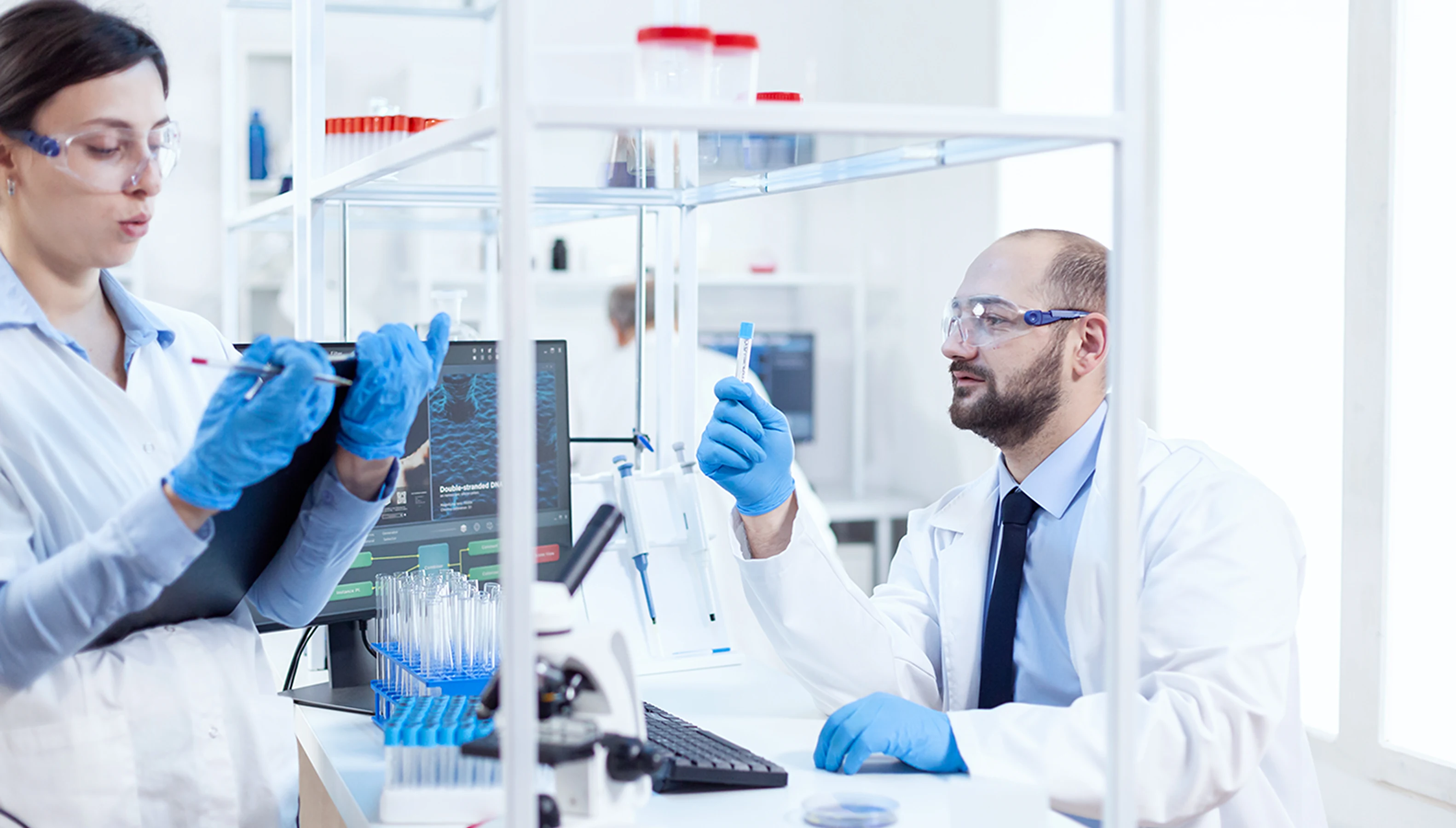 young-man-scientist-looking-pensive-chemical-solution-test-tubes-team-chemical-chemists-working-together-sterile-microbiology-lab-doing-research 1.webp